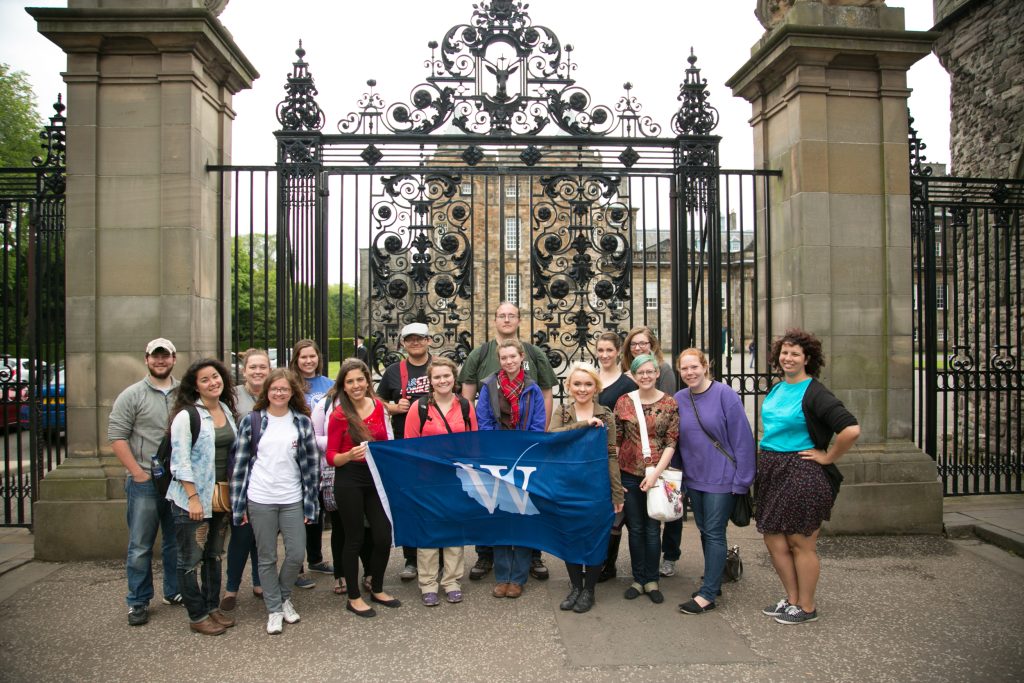 Group of students with The W flag in Scotland