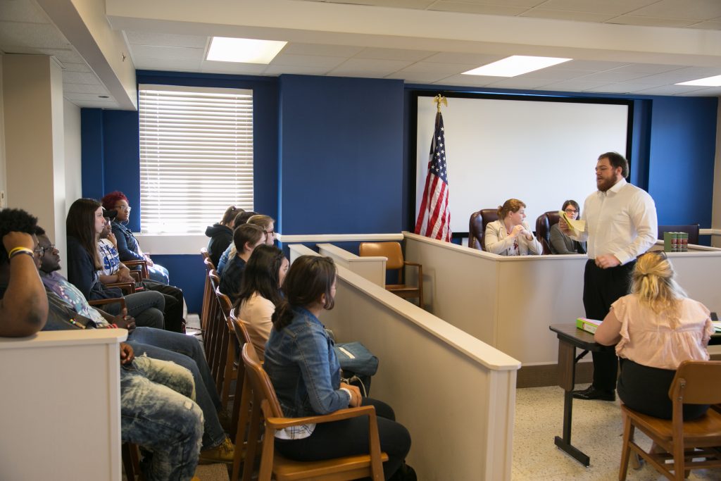 Male student makes presentation in mock trial courtroom