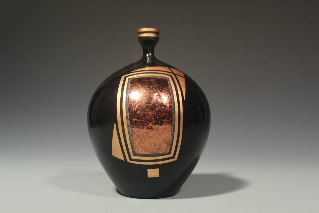 black and copper vase