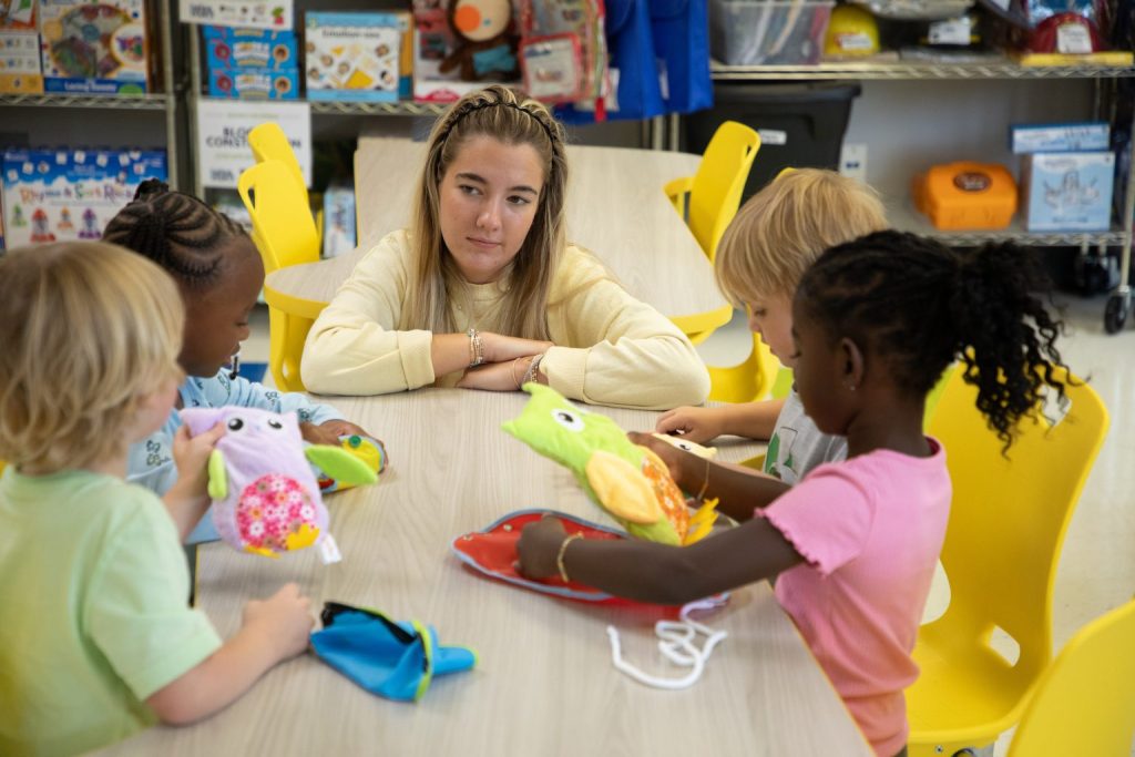 Young children playing with sensory toys