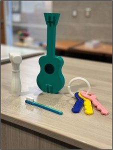 3d printed hammer, guitar, toothbrush, and keys