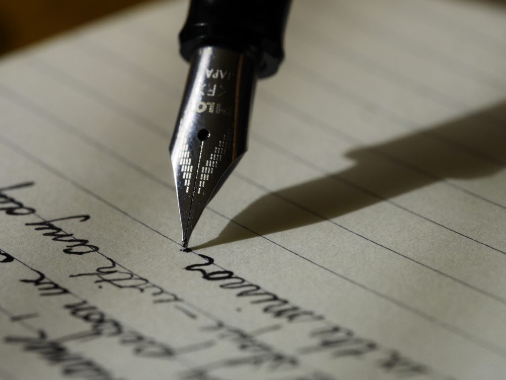 Fountain pen writing in a journal
