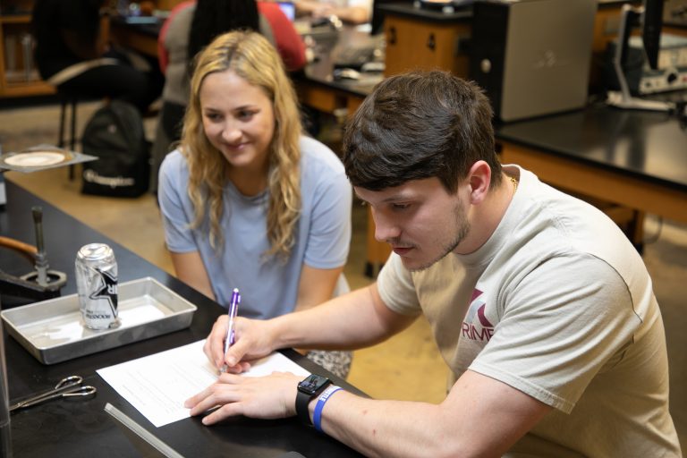 male and female student in physics lab