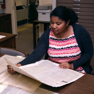 student working in an archive