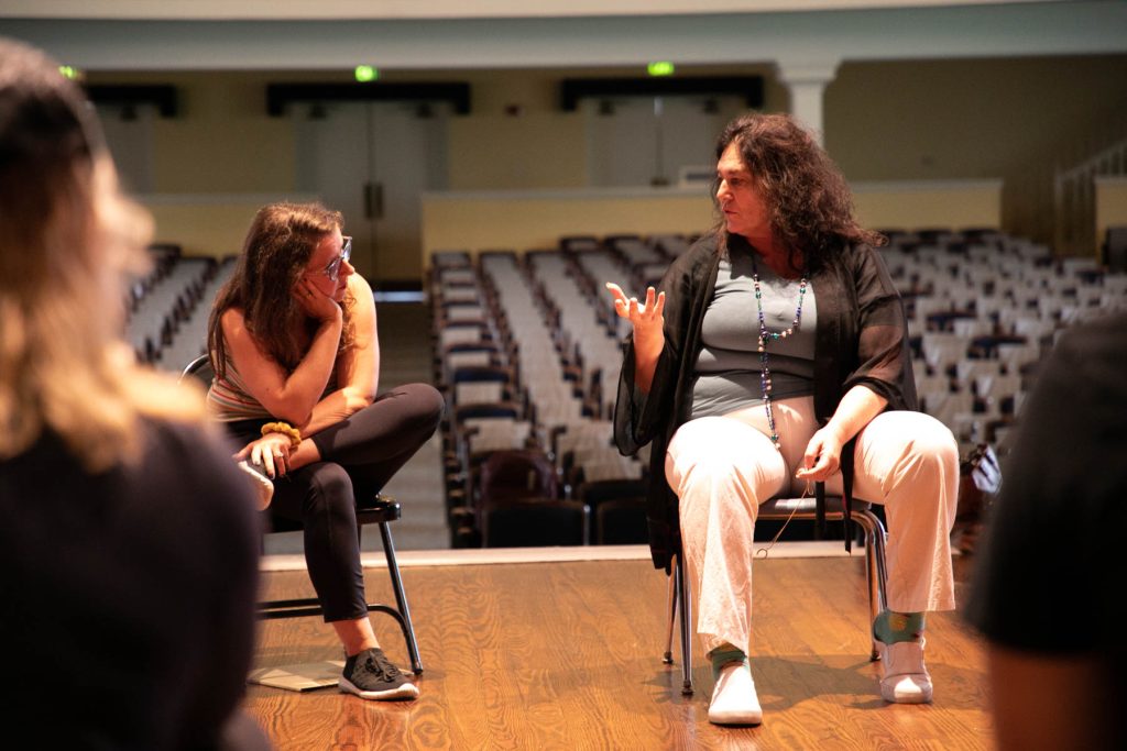 Professor speaks with theatre mfa students on stage
