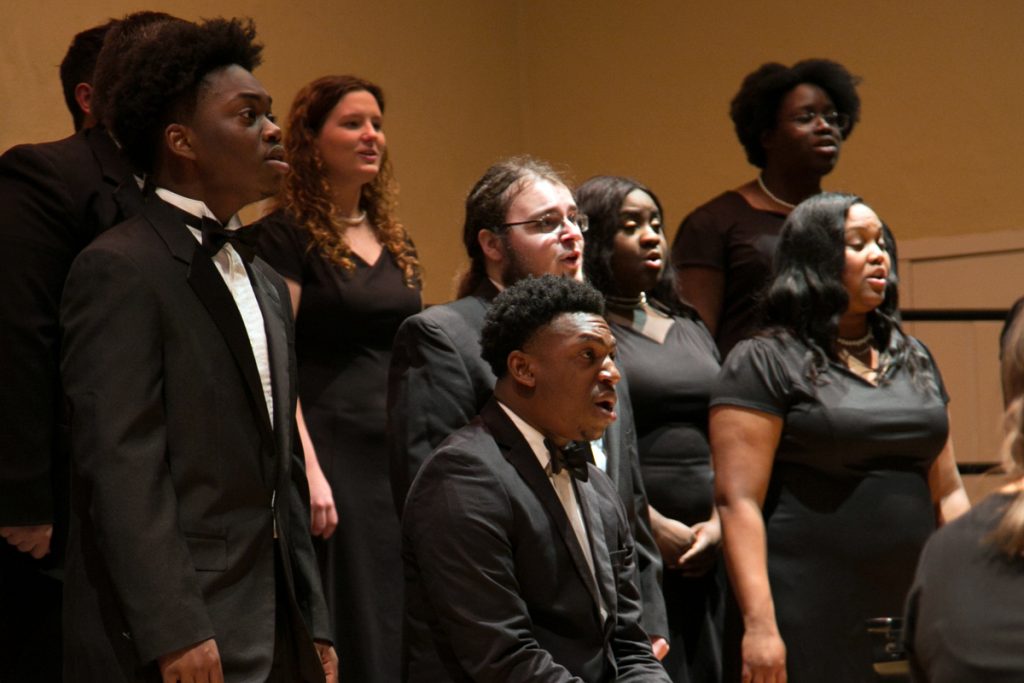The W Chambers singers perform on stage