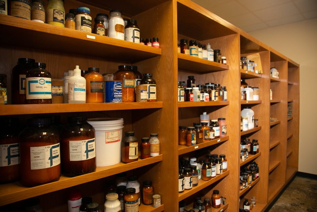 Containters of chemicals stored on a shelves