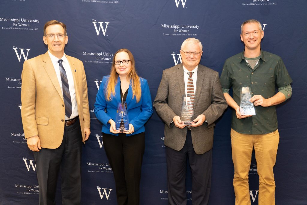 Dr. Traivs Hagey, far right, wins excellence in research award from MUW.