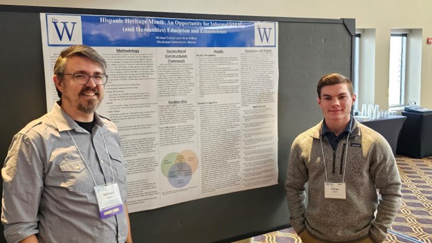 Michael Dodson and Ethan Wilkins presenting a poster at the ASTE International meeting.