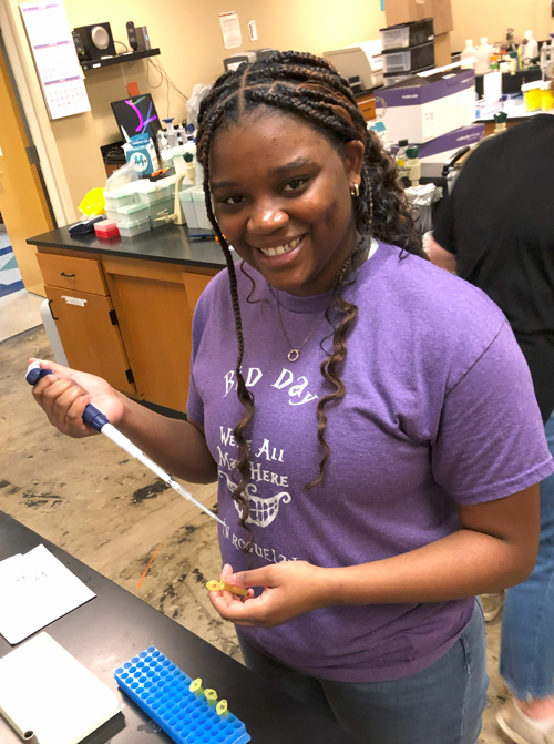 Laila Wrenn doing research in the lab.