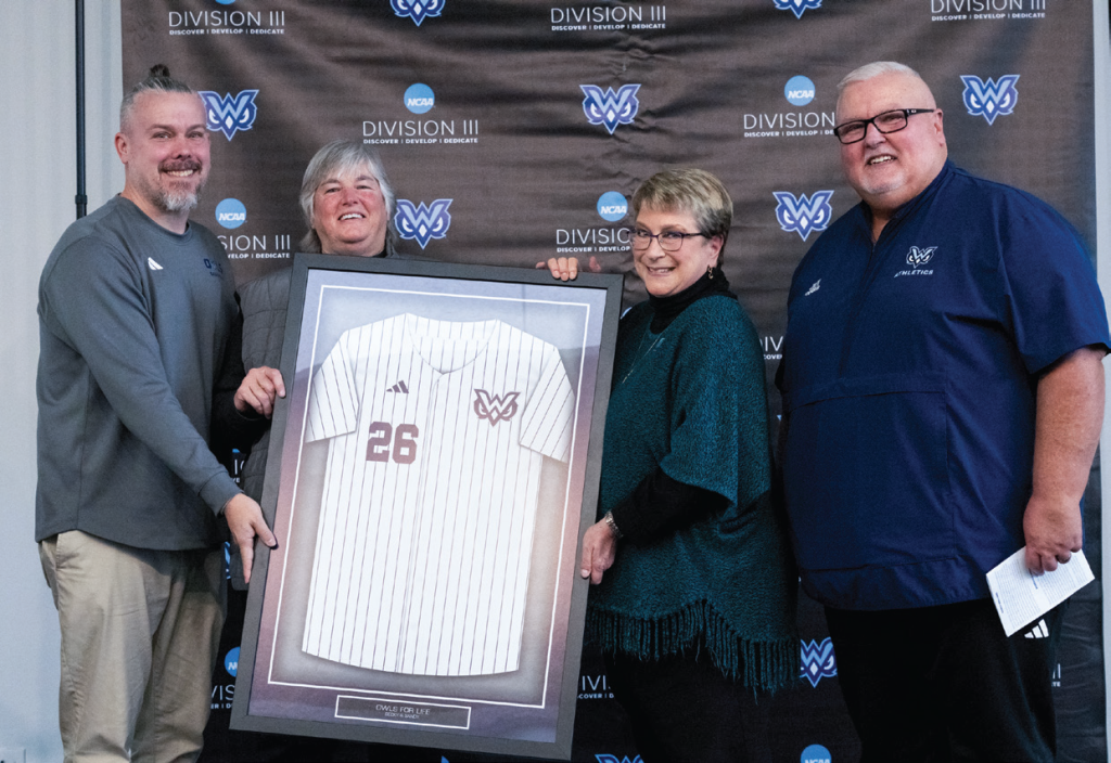 Dean Burrows, assistant athletic director, Sandy Holland, '86, Becky Smith, '83, and Buddy Foster, athletic director