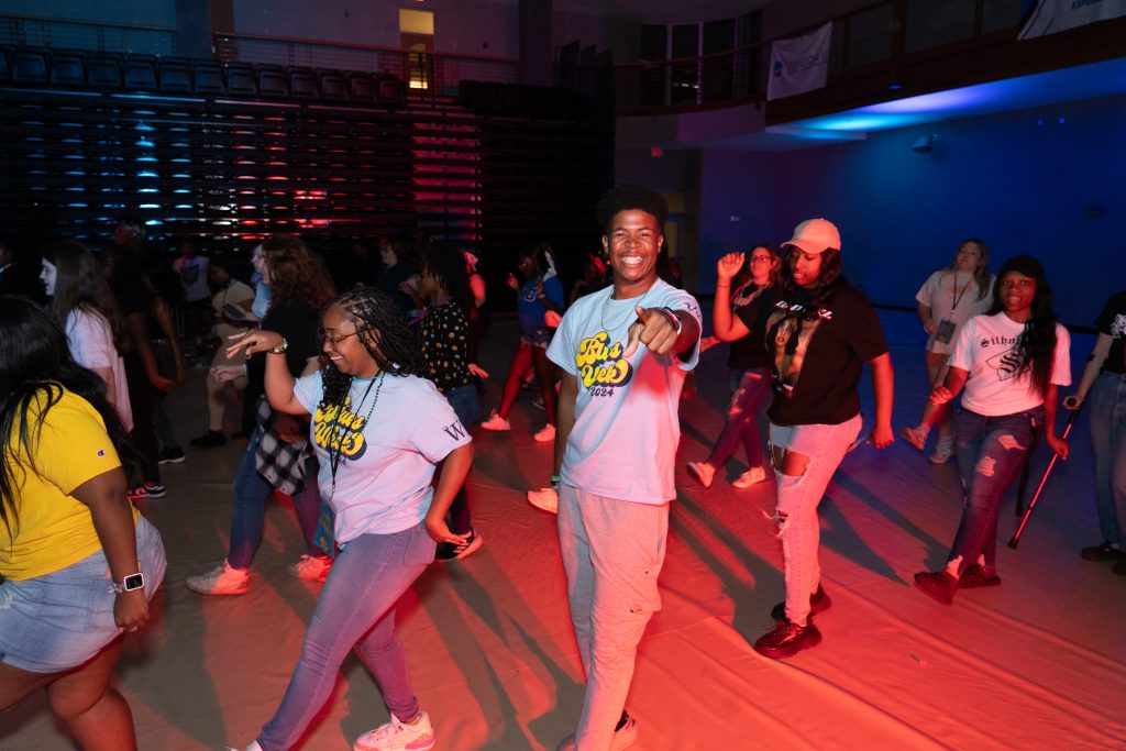 Students dance under red light at one of the Blues Week events last year at The W.