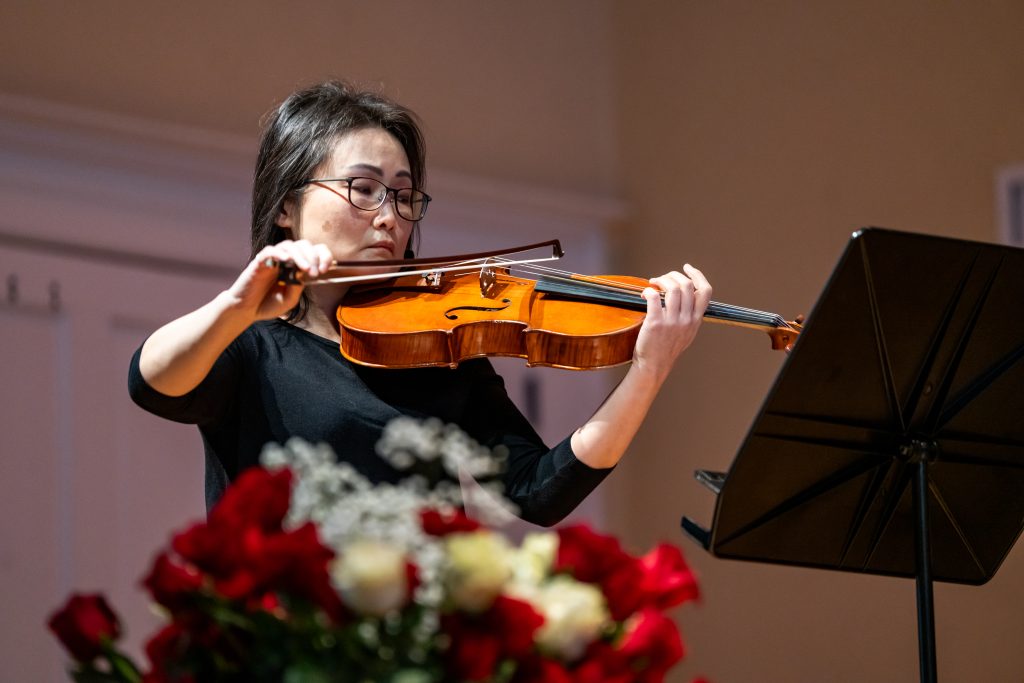 A woman plays the violin