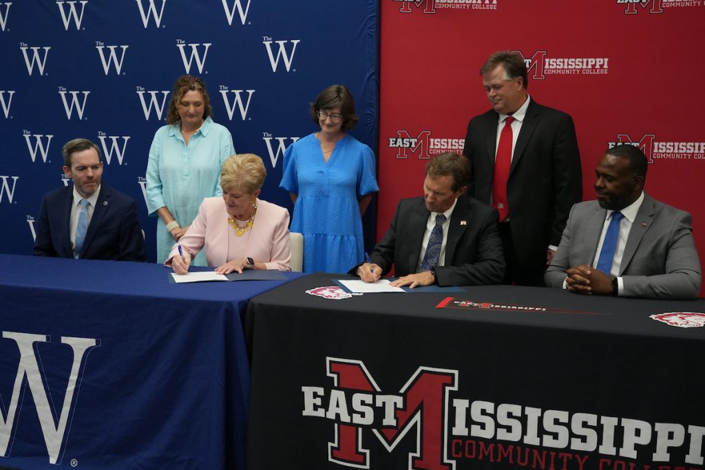 Seated, from left: Executive Vice president of Academic Affairs Dr. Scott Tollison, W President Nora Miller, EMCC President Dr. Scott Alsobrooks, EMCC Vice President of Instruction Dr. James Rush. Standing, from left: Chair of Department of Business Dr. Dee Larson, Dean of the College of Business and Professional Studies Kelly Woodford, EMCC Vice President of Career and Technical Workforce Education Dr. Michael Busby