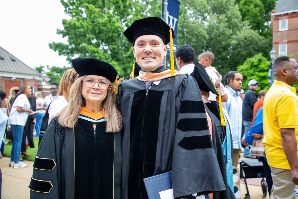 Hawkins poses with professor.