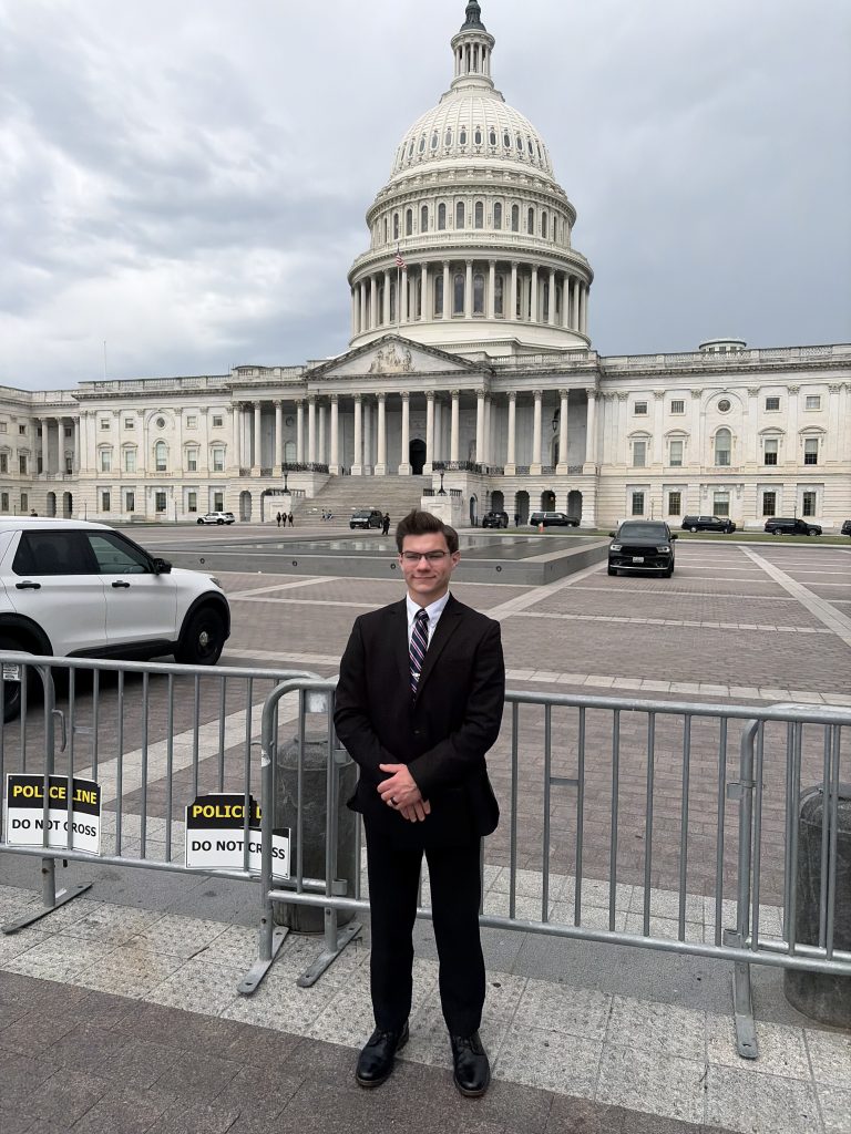 Ethan Wilkins in front of the Capitol building 