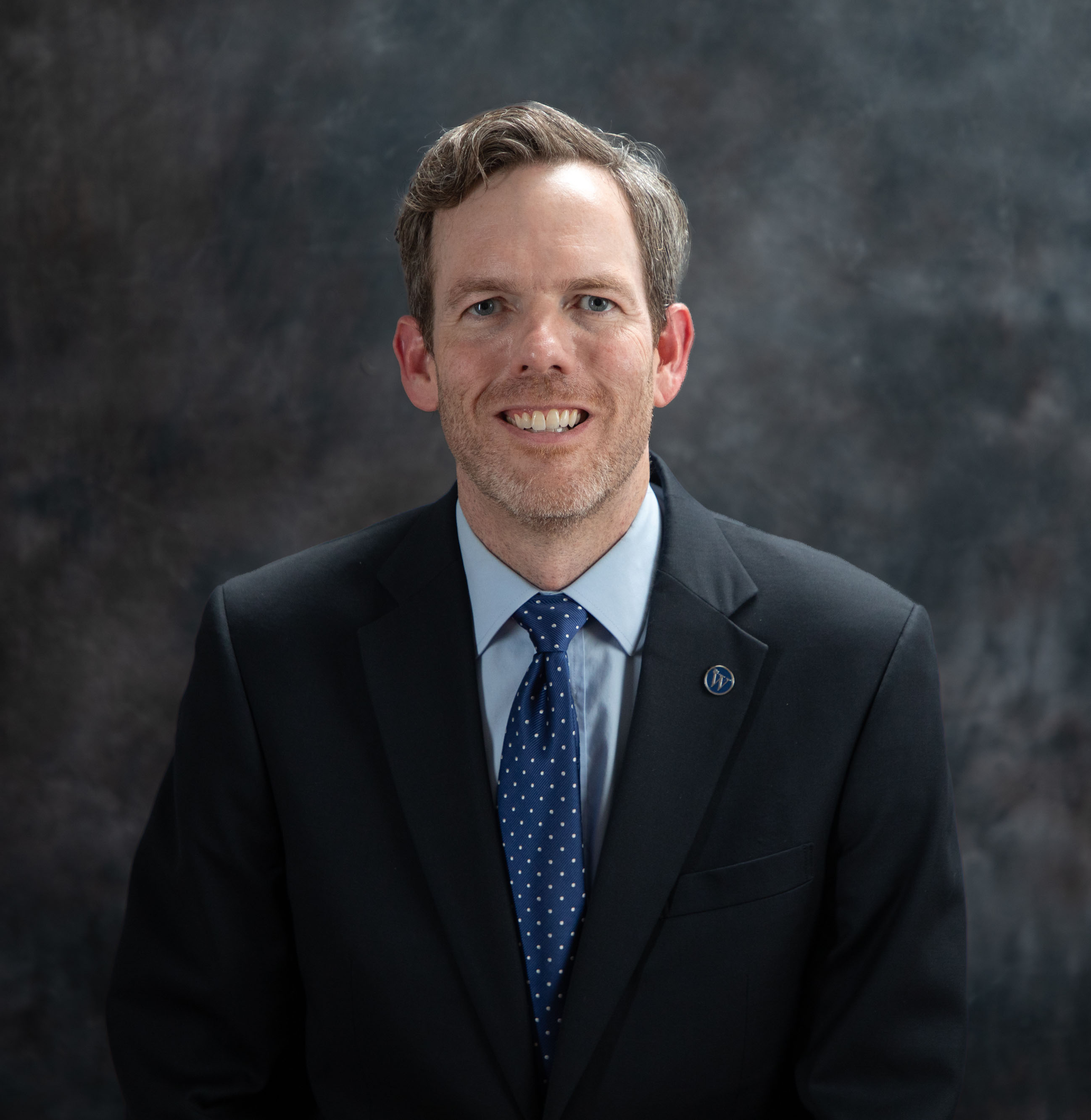 Interim President Scott Tollison, Ph.D. in a studio for his official photograph