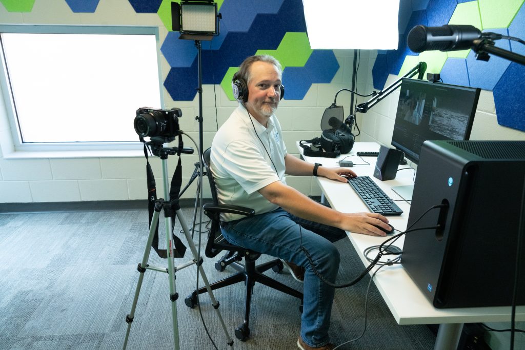 Barry Smith sits in podcast recording room.